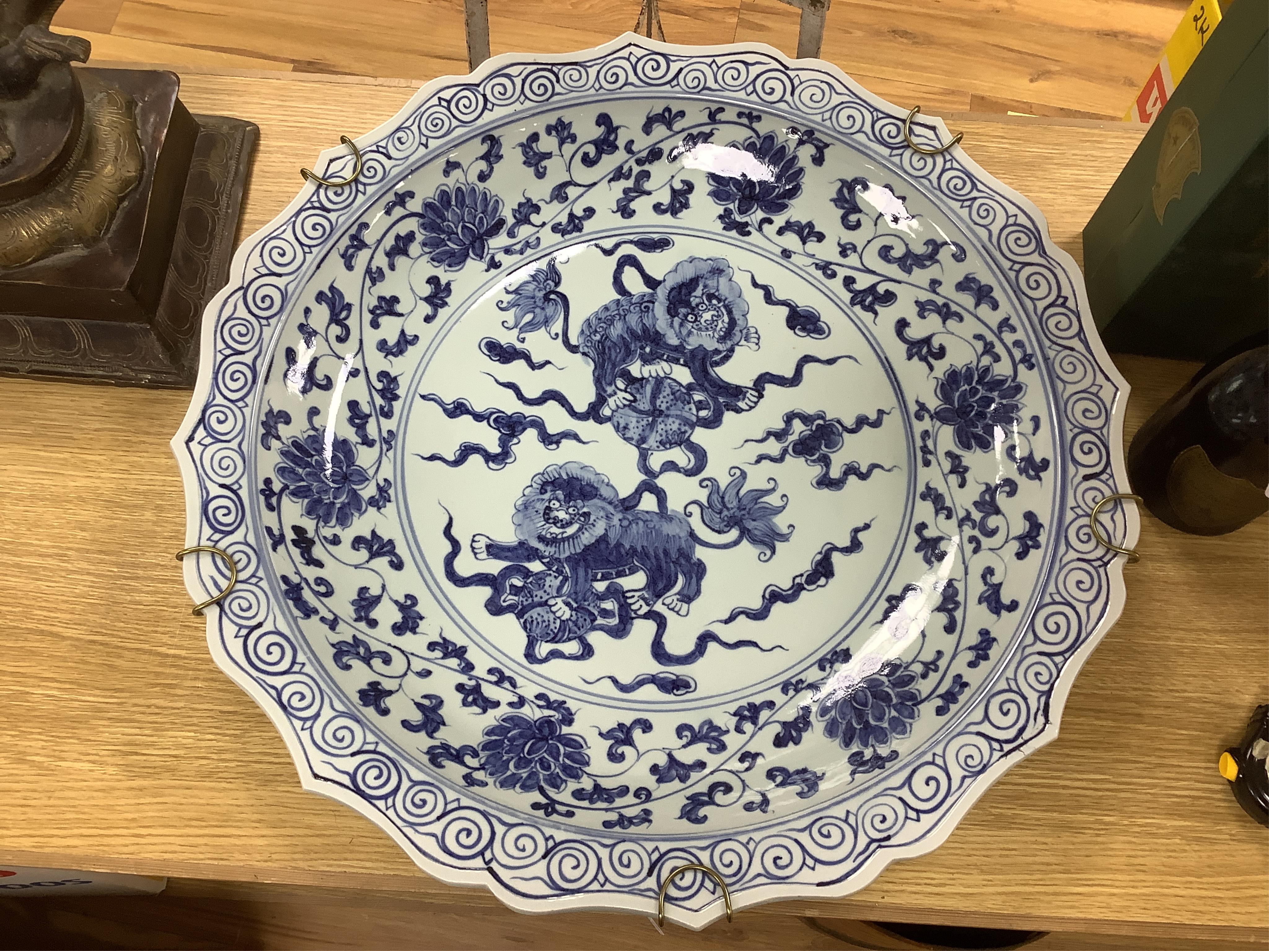 Two large Chinese blue and white chargers, largest 62cm diameter. Condition - good